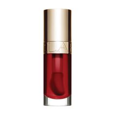 A nourishing lip treatment oil formulated with a trio of oils to comfort the lips with visibly plumping, high-shine results and a hint of color. Makeup made for skin. Clarins' iconic Lip Comfort Oil with a trio of high-shining, lip-plumping oils (including sweetbriar rose) that help soothe, protect and comfort lips with all-day hydration. Conditioning formula, enriched with 98% skincare ingredients, takes instant comfort to the next level while keeping its classic hint of sheer color and mirror- Clarins Lip Oil, Lipstick Application, Color Mirror, Natural Lip Colors, Aromatic Plant, Lip Products, Rose Oil, Skincare Ingredients, Makeup And Skincare