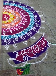 a colorful rangdi design on the ground