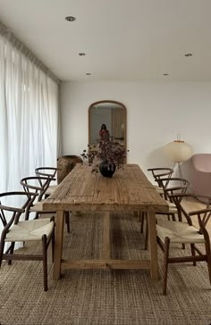 a large wooden table sitting in the middle of a room