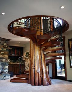 a spiral staircase in the middle of a living room