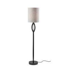 a floor lamp with a white shade on the base and a black metal frame around it