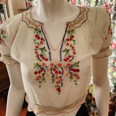 This Is An Authentic Hungarian Vintage Embroidered Muslin Blouse From The 1930s-1940s. It Is Rather Rare With The Cherry Embroidery. These Are Mostly Floral Embroidery Designs. They Were Made For The Tourist Market And Are All Hand-Embroidered. This One Is In Good Condition But It Does Have Some Flaws. (Remember, It's Almost 100 Yrs Old!) Some Of The Floss Is Pulled On Front; There Is A Repair Under The Armpit; The Elastic Is Stretched Out On Bottom Hem And The Snap Front Is Very Worn, The Snap Is Literally Hanging By A Thread. (I Would Wear It Open Anyway; It Looks Better!) I Have Shown All Of The Flaws In Photos But Feel Free To Ask For More Photos. Now, The One Drawback Is This Blou Embroidery Patterns For Blouses, Embroidered Peasant Blouse, Mexican Embroidered Blouse, Raya Core, Hungarian Clothing, Floral Embroidery Designs, Muslin Blouse, Polish Embroidery, Hanging By A Thread