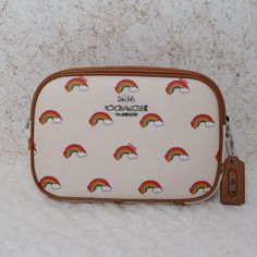 Coach Mini Jamie Camera Bag With Rainbow Print (Cj647) Chalk (White) Coated Canvas With Rainbow Print. Interior Slip Pocket. Exterior Slip Pocket. 22.75" Adjustable Strap. Silver Hardware. 7.5" (W) X 5.25" (H) Bags Coach, Chalk White, Rainbow Print, Silver Hardware, Coach Bags, Camera Bag, Chalk, Adjustable Straps, Bag Lady