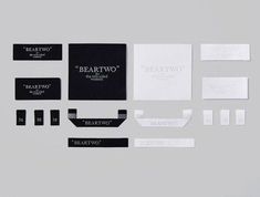 an assortment of black and white business cards on a gray background with the words beartroot written across them