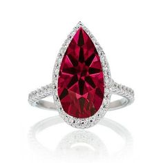 Pear Cut Ruby Halo Desiger Engagement for Woman. If you are looking for a Ruby gemstone engagement ring set at affordable prices then look no further than this beautiful Ruby and diamond wedding engagement ring. This ring can be customized to 10k 14k or 18k gold.. The diamonds are "I" Clarity and "I-J" color. Our gemstones are AA grade. The Diamond and Gemstone cut ranges from Round, Princess, Pear, Oval, Cushion.Most of our rings can be customized to your choice of metal like 10k Gold, 14k Gold Morganite Engagement Ring Vintage, Ruby Ring Set, Ruby Wedding Rings, Ruby Jewellery, Pink Morganite Engagement Ring, Fine Engagement Rings, Gemstone Engagement Ring, Dream Rings, Black Gold Jewelry