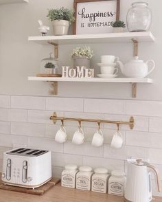 the kitchen counter is clean and ready to be used for breakfast or coffee break,