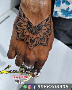 a person with a tattoo on their hand