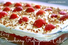 strawberry rhubarb relish cake with white frosting and strawberries