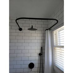 the shower head is black and white in color, but it's not too dark