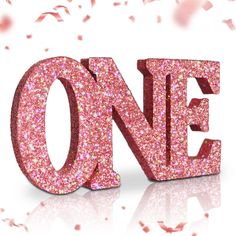 the word one is made up of pink glitter