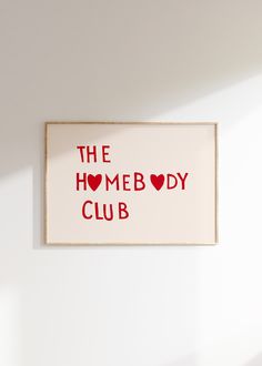 the homeboy club sign is hanging on the wall in front of a white wall