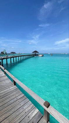 a wooden dock extends into the ocean