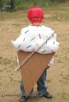 a young boy wearing an ice cream cone costume