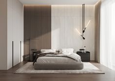 a large bed sitting in the middle of a bedroom next to a tall wall mounted lamp