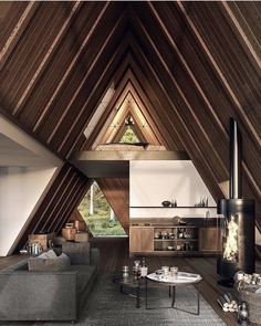 a living room filled with furniture and wooden walls