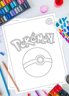 a pokemon coloring page with markers and crayons