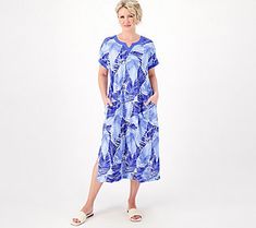 The caftan: summer's favorite silhouette. Fluid and feminine, this warm-weather staple flatters every figure with its easy, breezy nature. Throw it on over your swimsuit as an upscale cover-up, pair it with bold bangles and statement earrings when you take it out for brunch, or wear it around the house on those relaxed weekends. This caftan isn't just a style -- it's a lifestyle. From Stan Herman. Spring V-neck Beach Dress, V-neck Beach Sleepwear For Summer, Short Sleeve Beachwear Cover-up For Daywear, V-neck Summer Beach Dress For Loungewear, Summer V-neck Beach Dress Loungewear, Summer V-neck Beach Dress For Loungewear, Casual Beach Tunic Dress, Blue V-neck Sleepwear For Vacation, V-neck Relaxed Fit Summer Cover-up