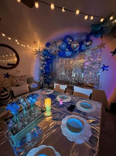 Blue party theme aesthetic, 18th birthday, sunlight lamp, silver, blue, party, cake, lights, gifts, balloons, balloon garland, blue balloon garland Blue And Silver Themed Birthday Party, Blue Birthday Theme Decorations, Blue Birthday Party Food, Blue Aesthetic Party Decor, Sapphire Birthday Theme, 18th Winter Birthday Party Ideas, Bday Party Inspo Aesthetic, Blue Bday Decorations