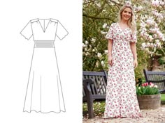 a woman standing next to a bench wearing a dress with short sleeves and floral print