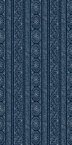 a blue and white striped wallpaper with an intricate design on the bottom half of it