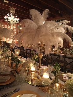 a table is set with candles and centerpieces for an elegant dinnereon party