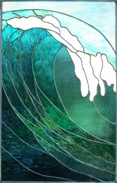 a stained glass window with a wave in the ocean on it's side,