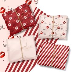 four wrapped presents are sitting next to each other on red and white striped wrapping paper