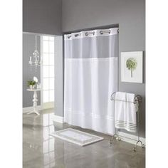 a white shower curtain in a bathroom