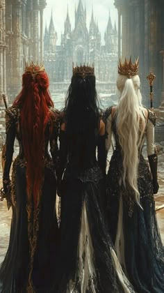 three women dressed in black and white are standing near each other with crowns on their heads