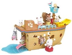 a wooden toy boat with animals on it