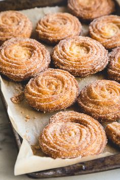 some sugary pastries sitting on top of a pan