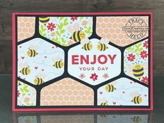 a card that says enjoy your day with honeycombs and bees on the front