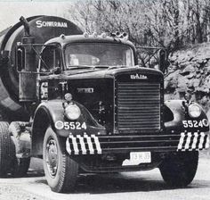 an old black and white photo of a large truck