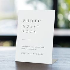 a photo guest book sitting on top of a table