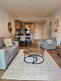 a living room filled with furniture and a flat screen tv