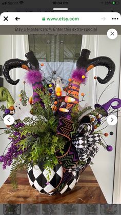 a vase filled with lots of halloween decorations