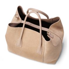 Practical and stylish, this mini weekender bag is ideal for an overnight getaway or for times when a roomy handbag is required on a busy day. Expertly made to the highest standards in Florence, Italy, it has shoulder straps or a longer detachable strap can be used for ease of transport. Suede Inside pocket Dimensions: 13.6"l x 6.7"w x 11.4"h Comes in a protective dust bag Made in Italy Care instructions: Only clean with a dry brush or dry cloth | AERIN Suede Mini Weekender size 13.6"l x 6.7"w x Luxury Everyday Satchel With Dust Bag, High-end Large Shoulder Bag For Everyday Use, Large Designer Beige Shoulder Bag, Large Beige Designer Shoulder Bag, Designer Large Beige Shoulder Bag, High-end Large Bag For Daily Use, High-end Large Bags For Daily Use, Luxury Large-capacity Bag, Everyday Luxury Large Capacity Rectangular Shoulder Bag