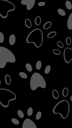 an animal paw prints pattern on a black background