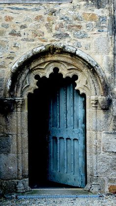 a black and white photo of an old door