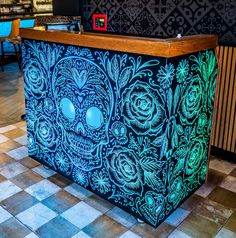 a brightly lit skull themed counter in a restaurant