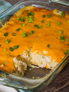 a casserole dish with green onions and cheese