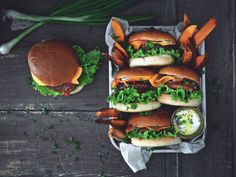 a tray filled with lots of sandwiches and fries