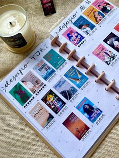 a calendar with stamps on it next to a candle