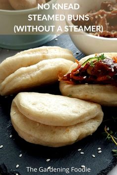 some food is sitting on a plate with the words, no knead steamed buns without a steamer