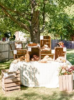 a table covered with bread under a tree