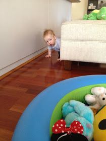 a baby is playing with stuffed animals on the floor