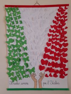 a flag made out of paper with hands and hearts in the colors of italy's flag