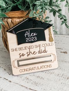 a wooden graduation decoration with the words she believed she could go she did congratulationss