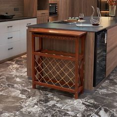 a kitchen with marble flooring and wooden cabinetry has a wine rack on the island