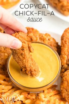 a person dipping sauce on chicken wings with the words copycat chick - fil - a sauce